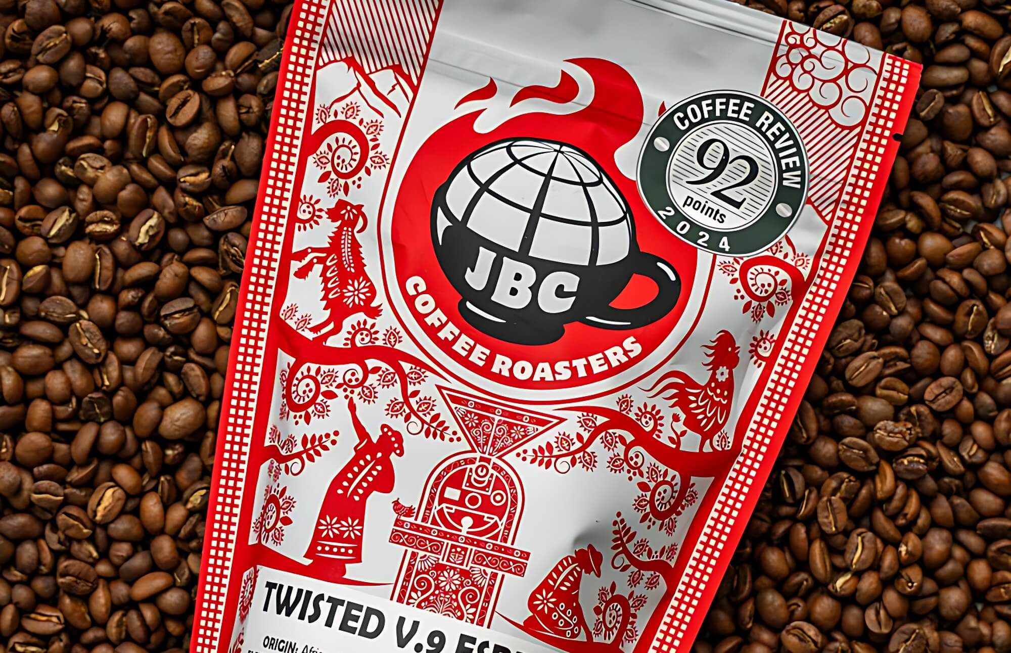 Bag of JBC Coffee Roasters Twisted V.9 Espresso with 92 points Coffee Review 2024 badge on a background of roasted coffee beans, served at Heyday Eatery.
